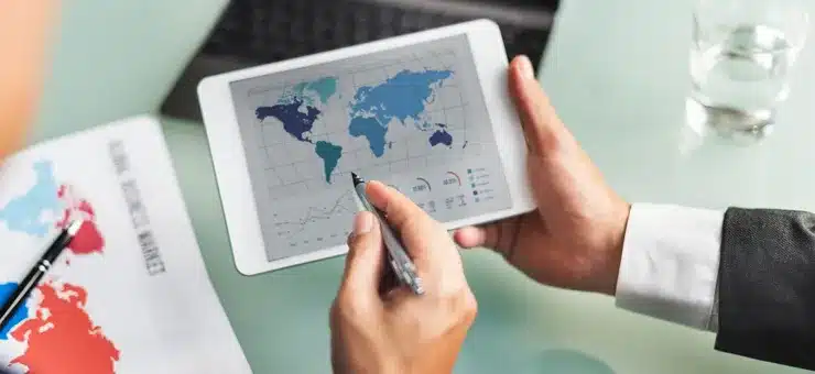 professionals analyzing global outsourcing market data and international business performance with Nearbridge
