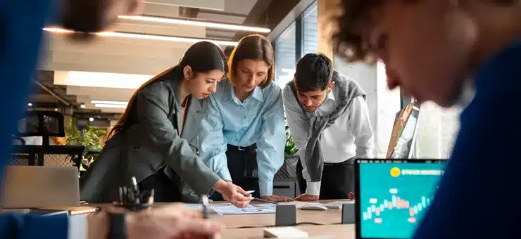 business team analyzing performance data to accelerate growth through outsourced operations in Nearbirdge